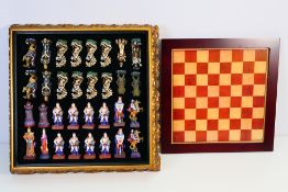 A fantasy style chess set with board, 8.5 cm (h) king.