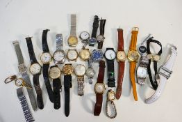 A collection of wristwatches to include Citizen, Timex and other.