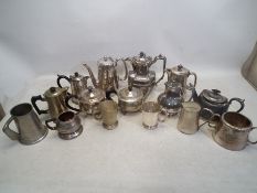A collection of Silver plated jugs, tea pots and cups, to include a Silver Plated Coffee Pot,