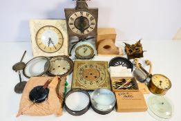 A box of various clock parts. [W]