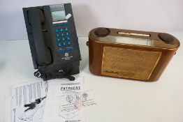 A Southwestern Bell payphone telephone (with handbook and keys) and a G.E.C vintage radio.