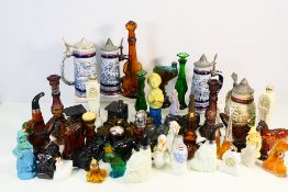 A collection of ceramic tankards and nov