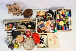 A collection of sewing / crafting equipment and accessories.