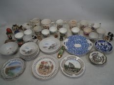A collection of ceramic cups and plates to include a part set of Japanese plates with 2 cups having