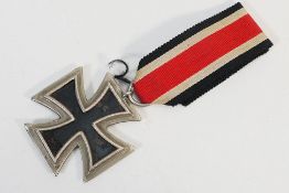 World War Two (WW2 / WWI) - An original German Iron Cross, 2nd Class with original ribbon.