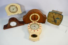 A collection of clocks and clock parts to include Smiths.