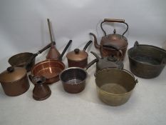 A collection of copper and brassware to