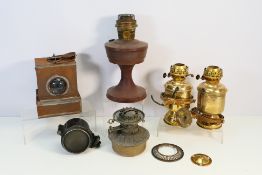A collection of oil lamp bases, a Britis
