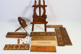 Treen to include cribbage boards, easel form photograph frame dated 1924 and a stereoscope viewer.