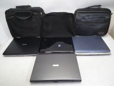 Toshiba - A collection of three Toshiba Laptop, one HP Laptop and three carry case.