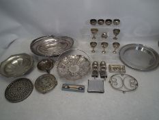 A collection of metal and plated ware to include an EPNS cruet set (the condiment pot have a cobalt