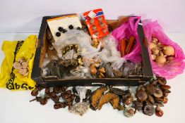 A large quantity of doorknobs / handles to include ceramic, brass and wood.
