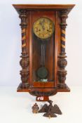 A Vienna style wall clock with pendulum, 78 cm.