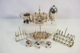 Plated ware to include toast racks, Elkington sugar dispenser, Mappin & Webb cruets and other.