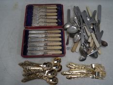 A collection of flatware to include a cased fish knife/fork set,