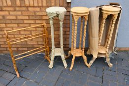 Three matching plant / jardiniere stands with carved decoration, 102 cm (h) and a wooden towel rail.