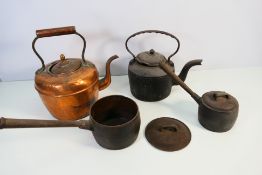 Metal ware to include cast iron cookwares by Thomas Holcroft & Sons and copper kettle.