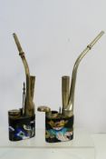 Two Chinese white metal and cloisonne water pipes.
