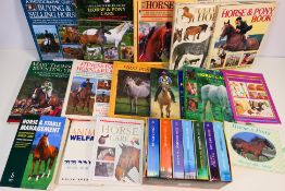 A collection of equestrian related publications and a John Grisham box set.