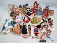 Costume Dolls - A mixed collection of various sized dolls,