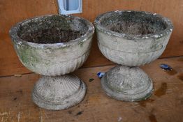A pair of reconstituted stone garden pla