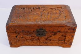 A small carved camphor wood chest approximately 15 cm x 30 cm x 17 cm.