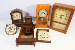 A collection of clocks and clock parts.