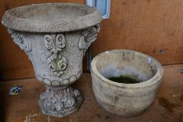 Two reconstituted stone garden planters.