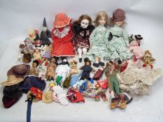 Dolls - A mixed collection of various sized four large porcelain Dolls,