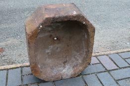 A hexagonal section garden planter. [W]