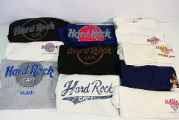 A collection of vintage Hard Rock Cafe T-Shirts, sizes large and XL.