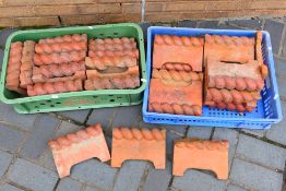 Two boxes of terracotta paving edging. [