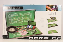 A boxed 3 In 1 Casino Set comprising roulette, craps and blackjack.