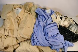 Ex MOD uniform and accessories, a large collection of mostly fawn/sand coloured shirts,