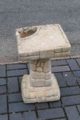 A reconstituted stone garden bird bath /