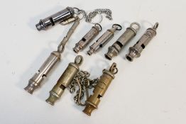 Police whistles and similar x 8 - To include: 1 x Metropolitan police with chain,