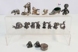 A collection of approximately 15 pewter figures and a pin cushion to include: Myth & Magic figures