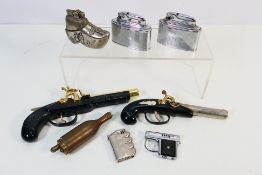 Lighters - A collection of eight vintage lighters of various shapes to include three guns,