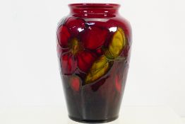 Moorcroft - A Walter Moorcroft pottery flambe vase decorated in the Clematis pattern,