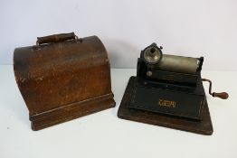 An oak cased Edison Gem Phonograph, serial number 293906C, no horn or cylinders.
