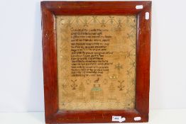 An antique needlework sampler with verse, a house and decorative border, Isabella, Aged 9,