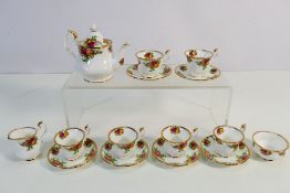 Royal Albert - A novelty miniature tea set decorated in the Old Country Roses pattern comprising