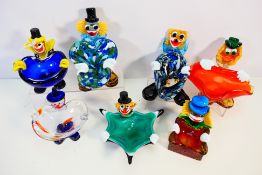 A collection of Murano glass dishes with clown theme. Hat detached from one.