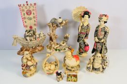 A collection of Chinese faux ivory figures / groups, largest approximately 32 cm (h).