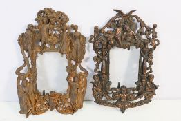 Two Edwardian cast iron photograph frames, the first cast with putti, Rd No 553836,