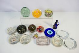 A collection of paperweights with advertising examples to include Henley's Telegraph Works,