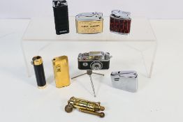 Lighters - Eight vintage lighters to include a camera lighter a Terry Rogers lighter a brass