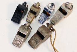 Referee whistles - Five Acme referee whistles and a Halex whistle.