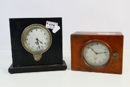 Two Smiths car dashboard clocks mounted in wooden cases as mantel / desk clocks, largest 16.