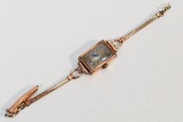 A 9ct gold cased wristwatch on gold filled bracelet (A/F), approximately 11.9 grams gross.